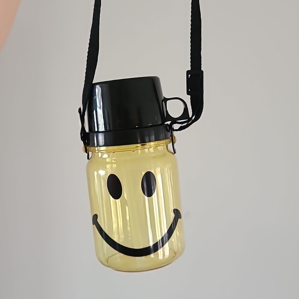 Vintage 90s smiley face water bottle with cup